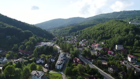 drone shot of stunning mountain town in poland, szczyrk