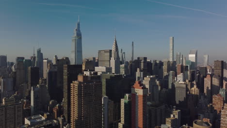 Elevated-view-of-midtown-towers.-Heading-to-iconic-Chrysler-building-with-tall-spire.-Manhattan,-New-York-City,-USA