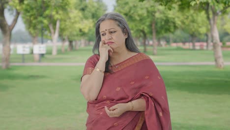 Confused-Indian-old-woman-thinking-in-park