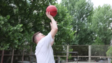 father and daughter playing basketball outdoors