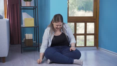 the young woman who punches the wall in anger.