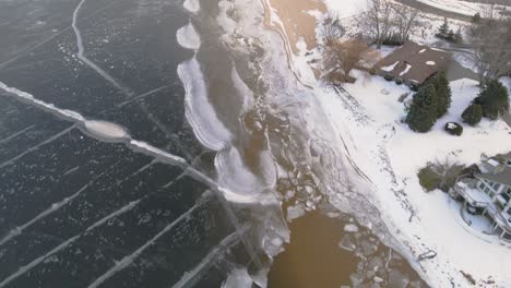Aerial-track-with-drone-over-ice-formations-on-a-shallow-shoreline