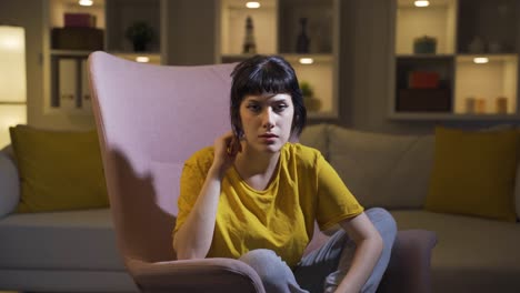 young woman looking at camera with trouble.