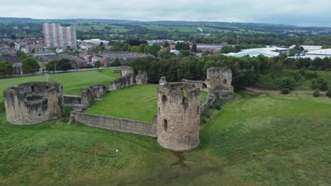 flint castle welsh medieval coastal military fortress ruin aerial view push in to tower