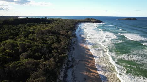 foamy sea waves at dreamtime beach in fingal head, nsw, australia - drone shot