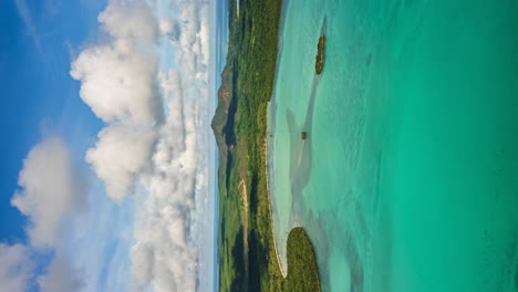 Vertical-aerial-hyperlapse-flying-towards-paradisiacal-Isle-of-Pines-and-pristine-waters-of-New-Caledonia