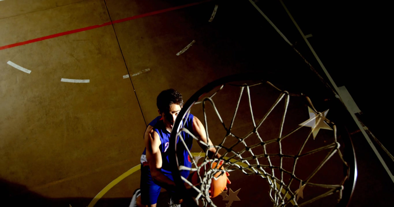 Basketball athlete crouching near free-throw dribbling toward rim dunking scoring points for sports