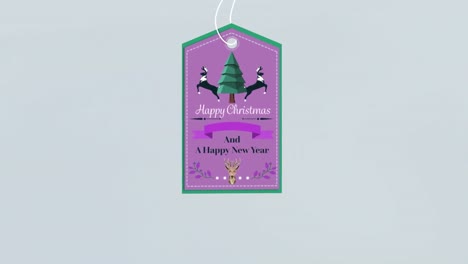 animation of christmas greetings on tag on grey background