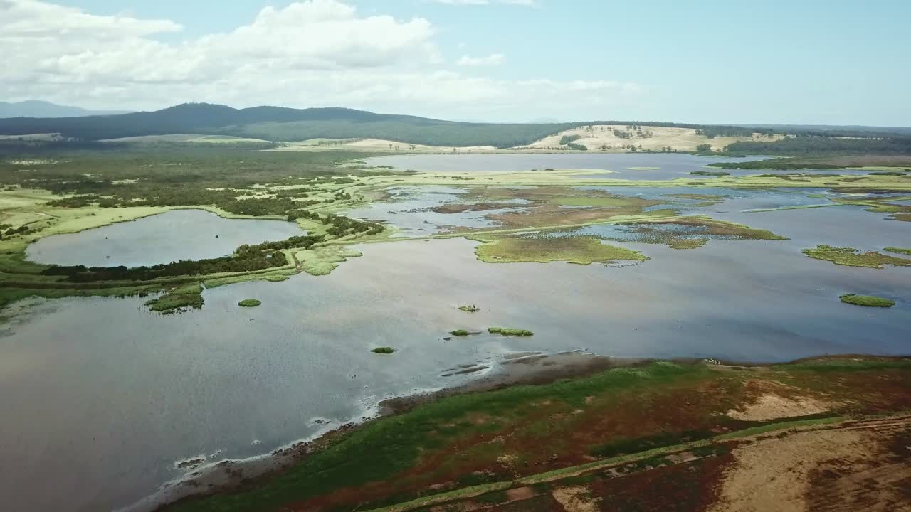 Aerial footage of the flood plains of the Lake Curlip Wildlife Reserve, alongside the Snowy River, near Marlo, in Gippsland, Victoria, Australia, December 2020