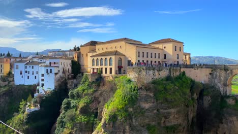 beautiful blue sky and city view on historical puente nuevo bridge in ronda spain, 4k panning right