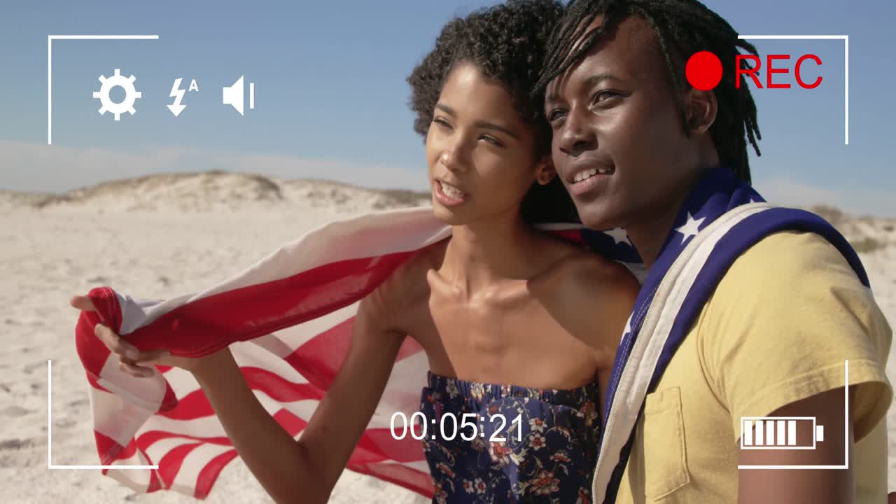 filmando una pareja en una playa con una cámara digital 4k