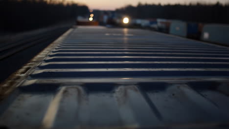 view from the top of a freight train container at dusk