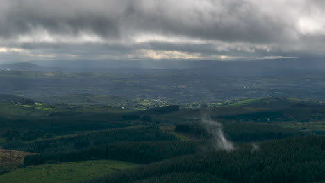 Time-lapse-of-countryside-landscape-with-hills-and-fields-on-a-cloudy-dramatic-day-in-rural-Ireland