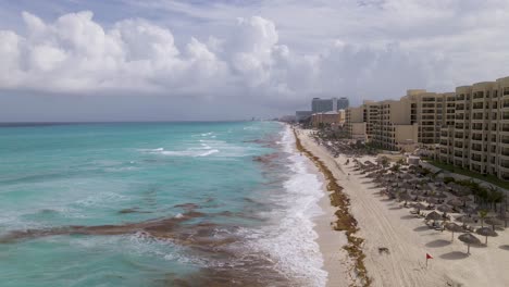 aerial view showing cityscape of cancun with famous resort city by caribbean sea - landscape panorama of from above, mexico, central america, 4k