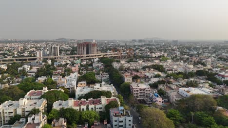 chennai skyline with metro project cutting through city blocks at sunrise