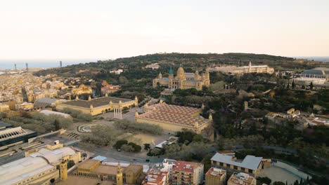 aerial panoramic establishing view of museu nacional d'art de catalunya, at sunset, barcelona spain