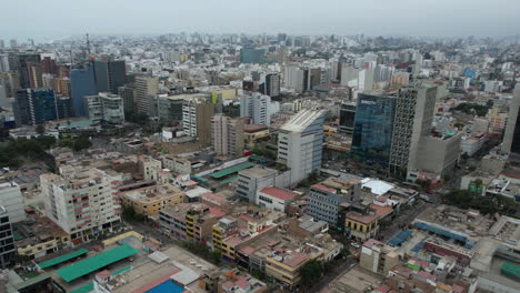 aerial view of a dense city with numerous buildings under a hazy sky