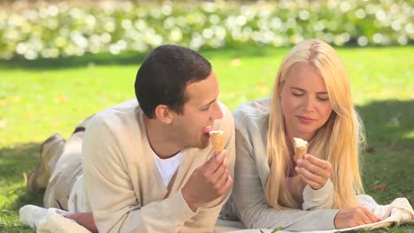 young couple eating icecream