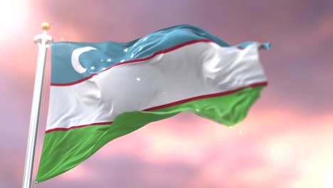 uzbekistan flag waving at wind in slow at sunset, loop
