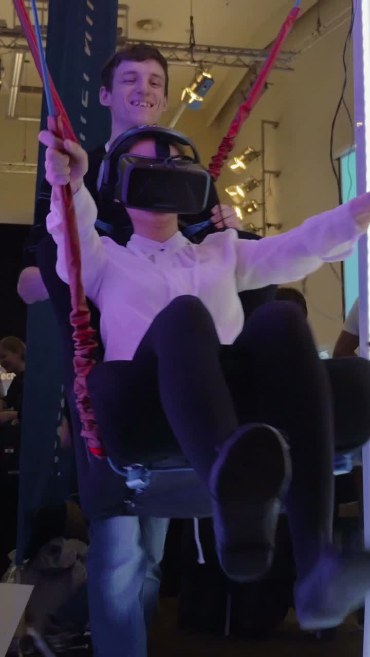 Person using VR headset on a swing
