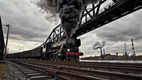 vintage steam train crossing a bridge