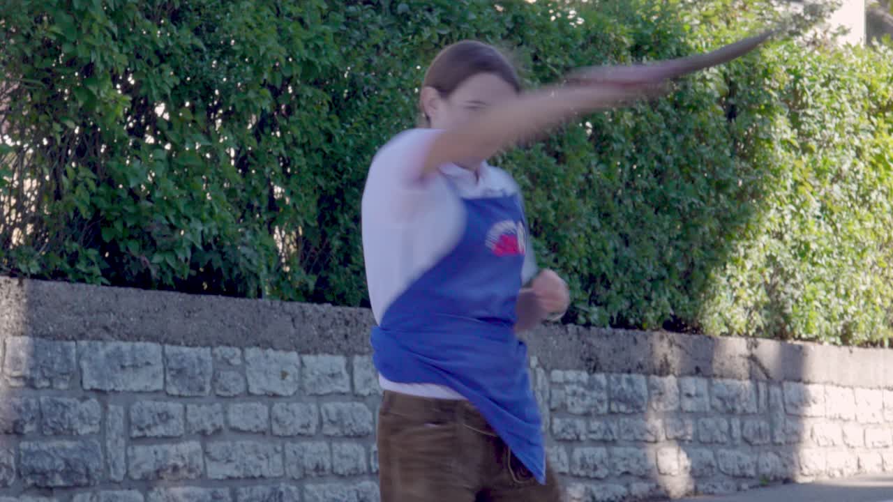 La brava Part Parade - a girl cracking the whip, Folgaria, Alpe Cimbra, Trentino, Italy