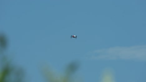 drone-flying-through-blue-skies-and-sunny-weather