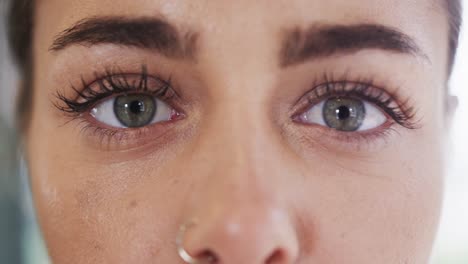 Close-up-portrait-of-caucasian-young-woman-with-hazel-eyes-in-yoga-studio