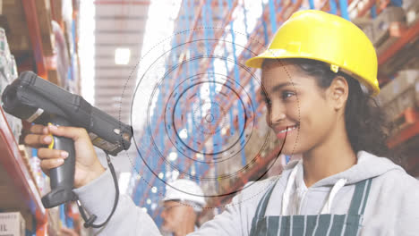 Animation-of-scope-scanning-over-woman-working-in-warehouse