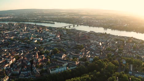 summer sunset over mainz approaching the dom church with the rhine river and bridge in the background