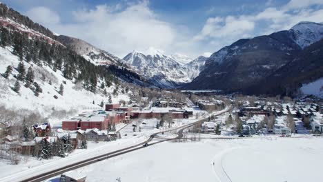 Drone-aerial-view-of-cars-entering-Telluride-Colorado-on-a-sunny-day