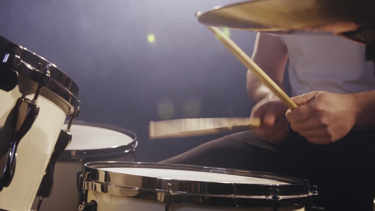 Man plays drums on stage 4K