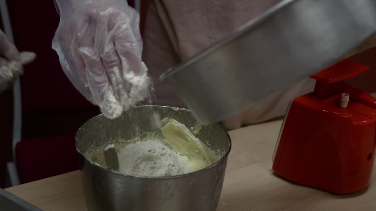 Pour flour into a mixture of biscuit ingredients