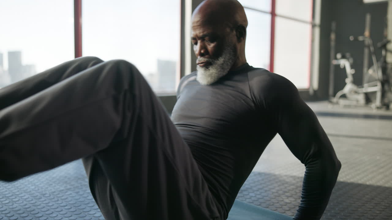 Senior Man Exercising in Gym