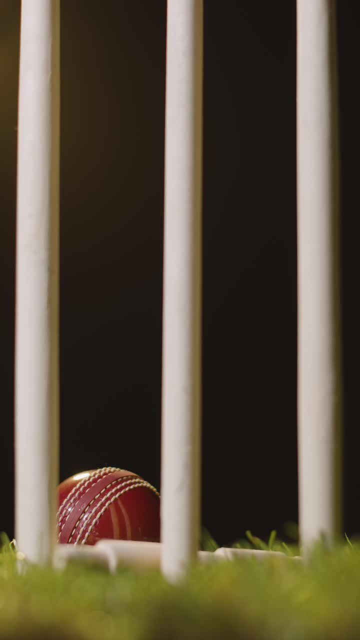 Vertical Video Cricket Still Life With Close Up Of Ball Hitting Stumps Bowling Out Batsman
