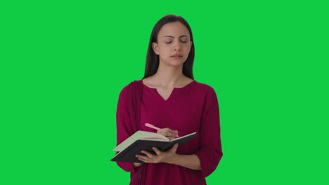 Indian-female-teacher-taking-attendance-Green-screen