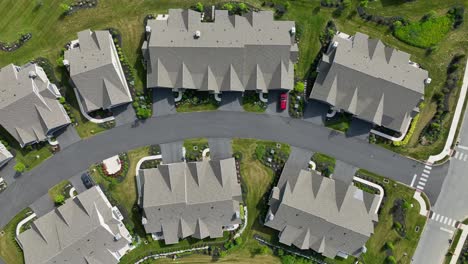 aerial view of several townhouses on a private and quiet street on a beautiful summer day