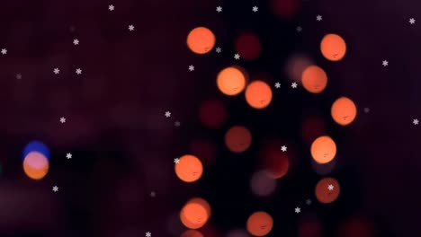 Animation-of-out-of-focus-christmas-fairy-lights-and-snow-falling