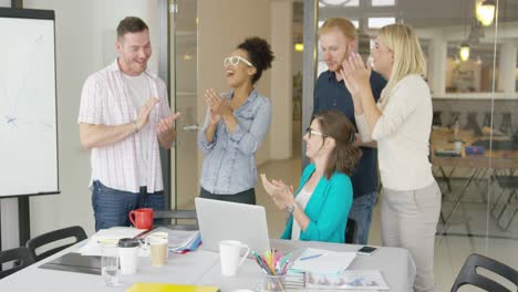 cheerful coworkers celebrating