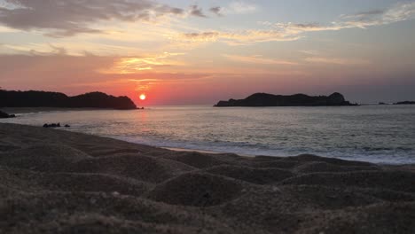 stunning sunrise or sunset over pacific ocean, huatulco bay beach