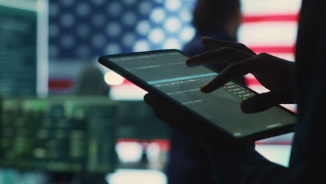 cybersecurity expert in a governmental it environment with the american flag