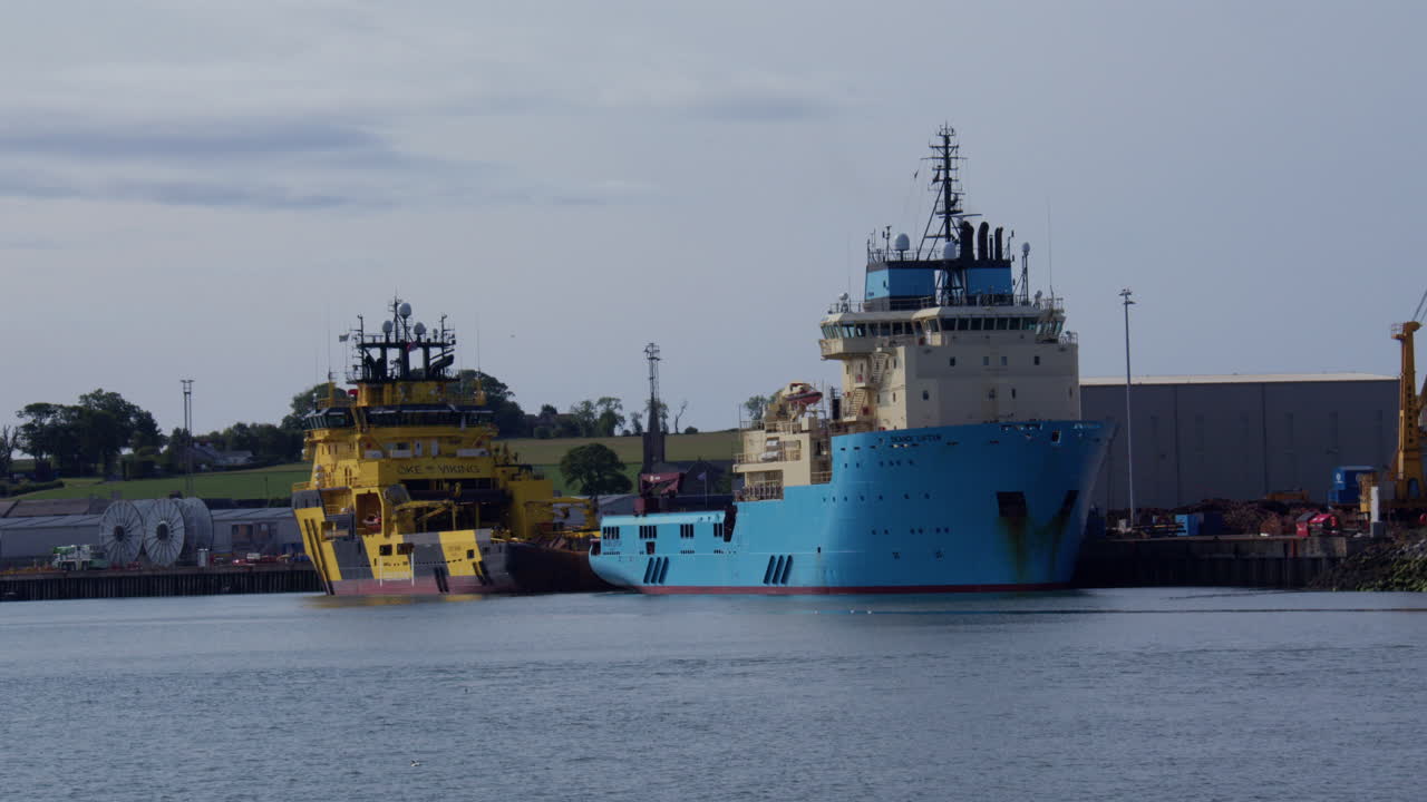 shot of two commercial seagoing ships in harbour at river south Esk, Montrose