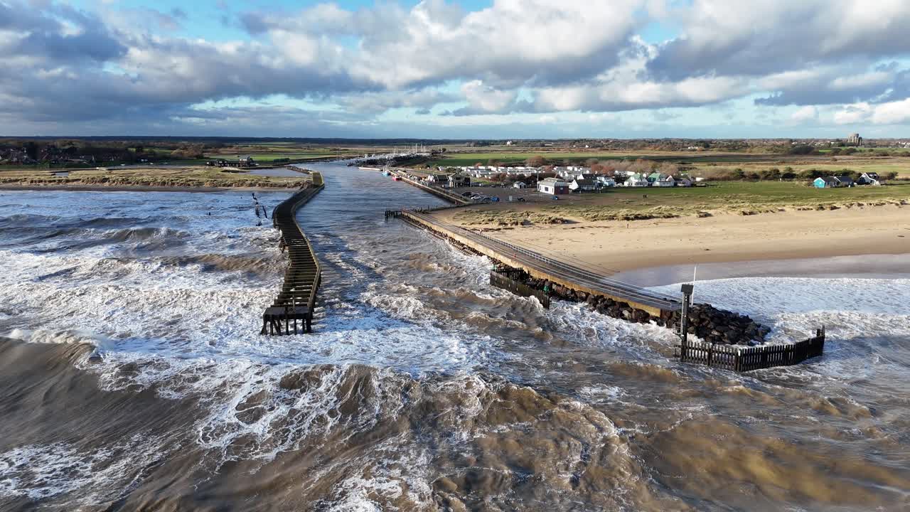 Stormy seas Southwold Harbour mooring in Suffolk UK drone,aerial