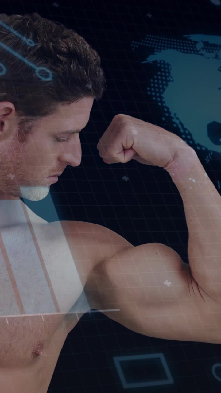 Vertical video: Male fitness model tensing fist turning wrist, causing HUD globe mapping strength