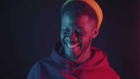 smiling man in neon light