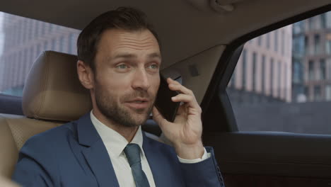 businessman talking on phone in auto