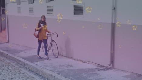 Multiple-golden-star-icons-against-woman-in-hijab-with-bicycle-walking-on-the-street