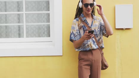 mixed race man listening to music with headphone