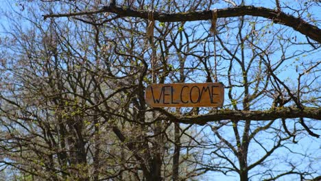 welcome sign on wood. selective focus. nature.