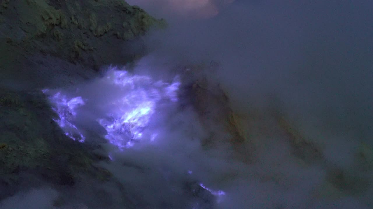 4K Video: blue sulfur flames at volcano, Kawah Ijen volcano, East Java, Indonesia.